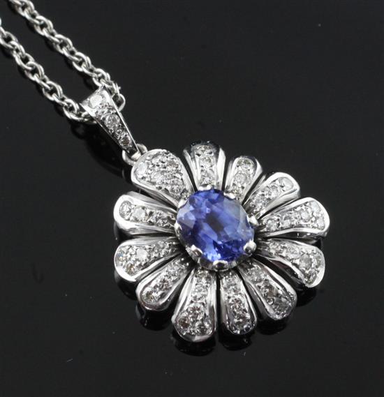 A modern white gold, sapphire and diamond set pendant, pendant 24mm inc. bale.